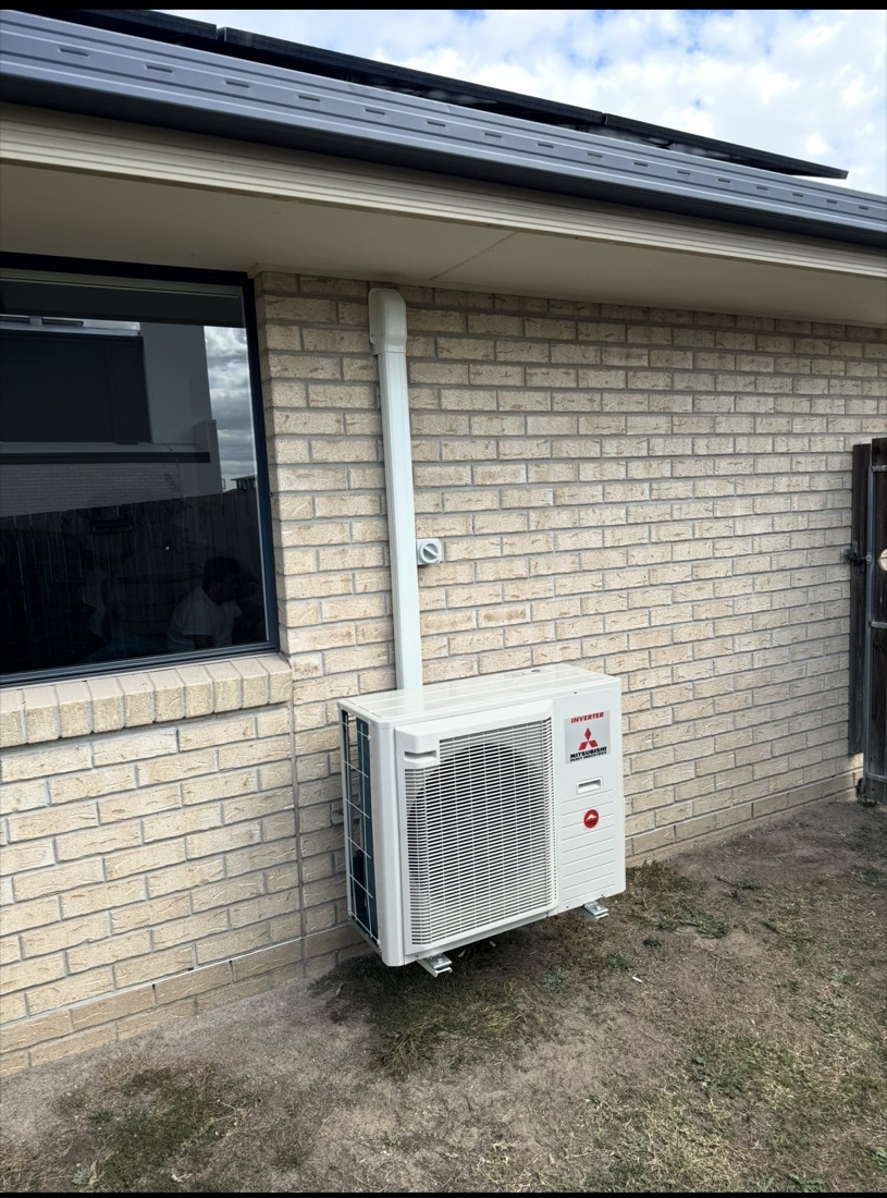 Outdoor unit with neat pipe cover