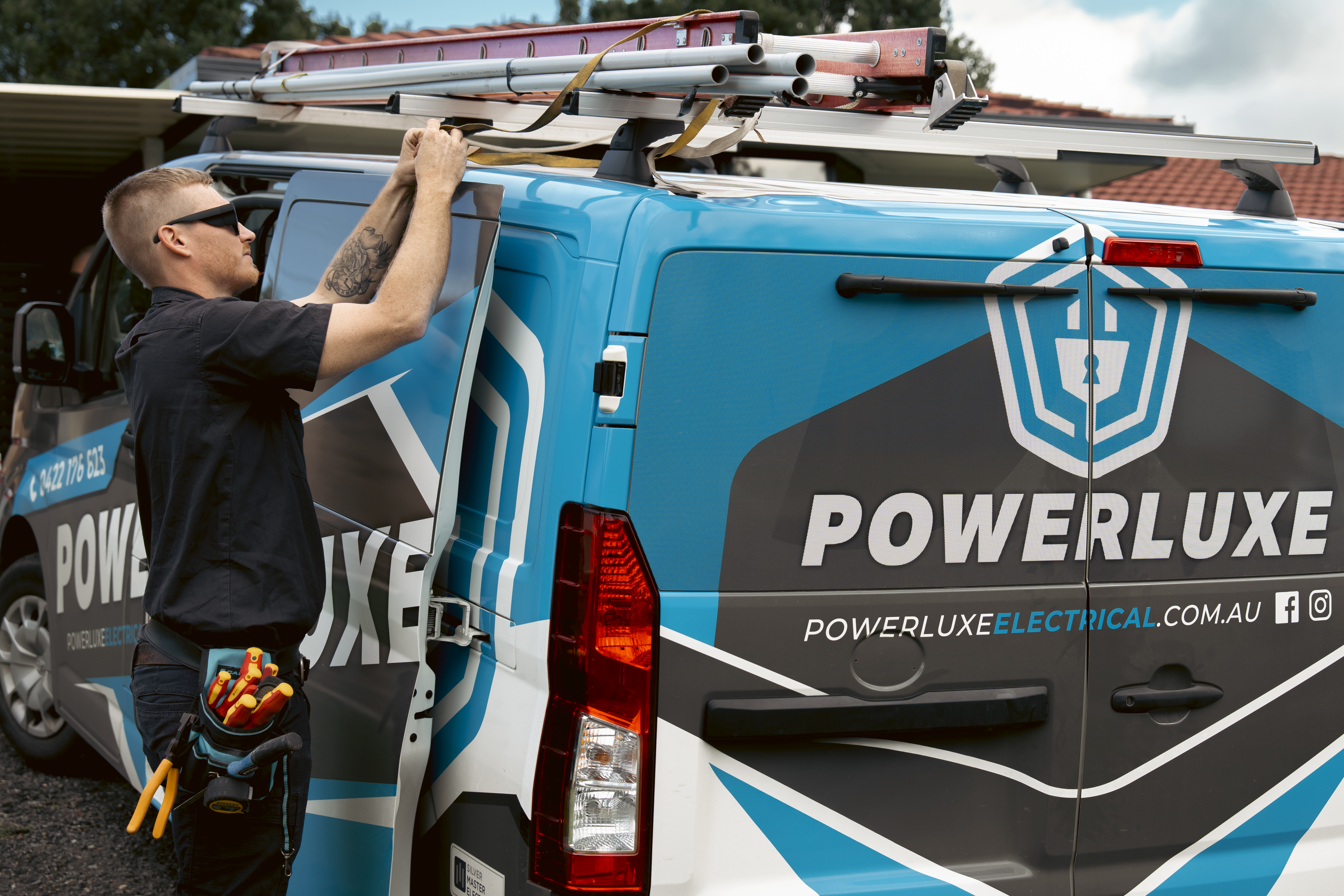 Powerluxe electrician loading van